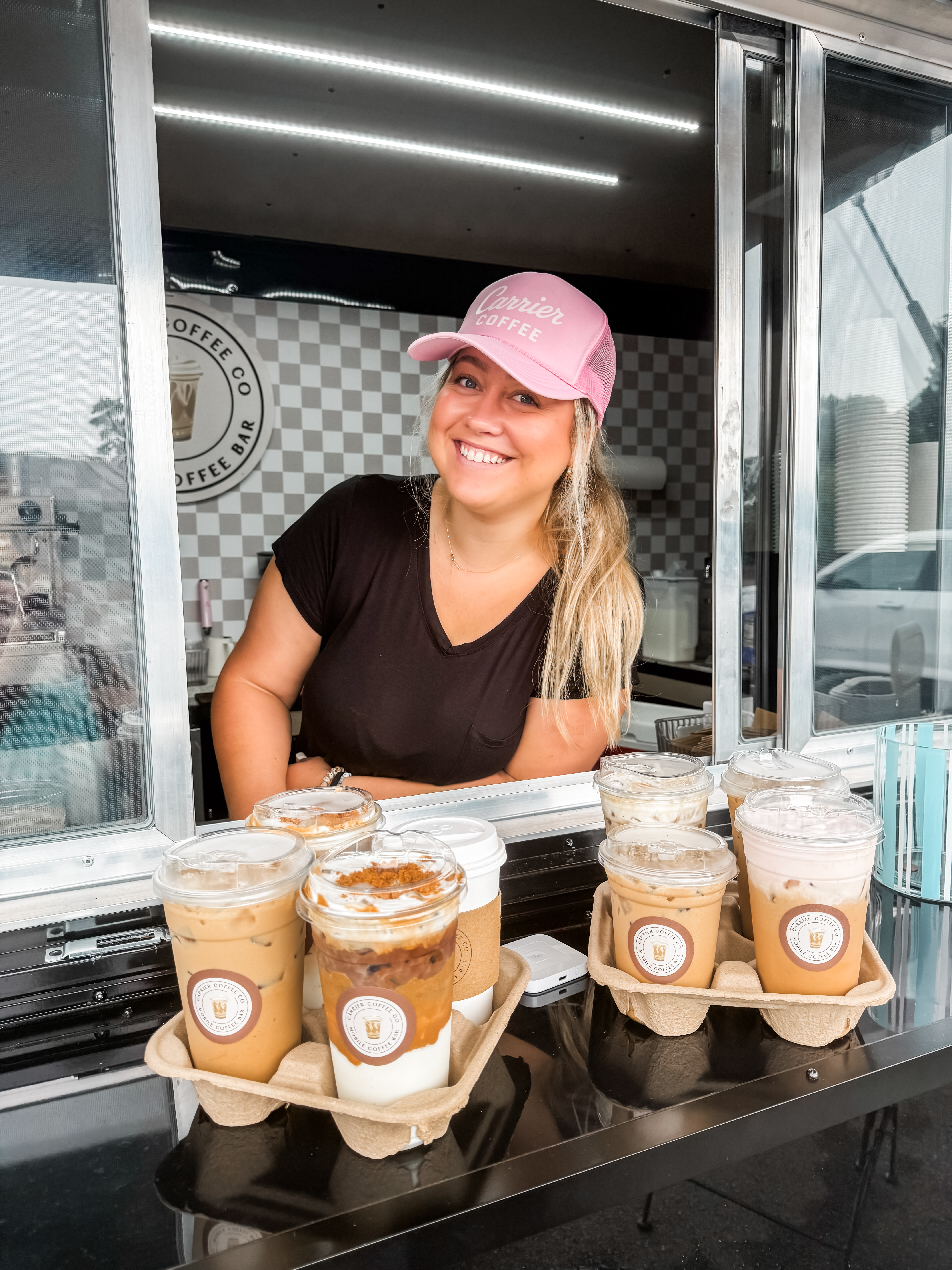 Serving iced lattes from the trailer window